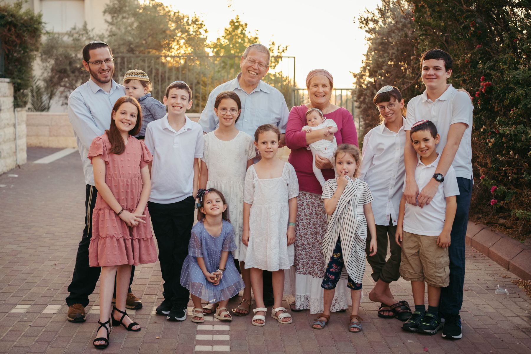 Large family on a Jerusalem street at golden hour