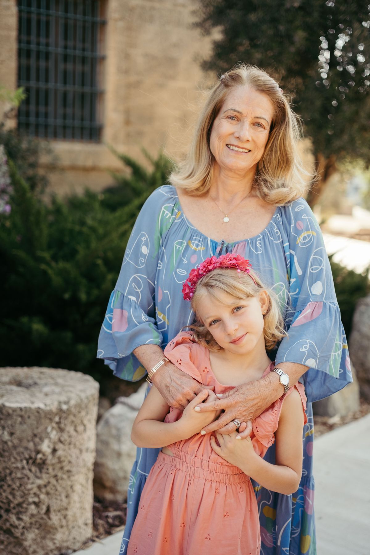 Grandmother hugging her granddaughter