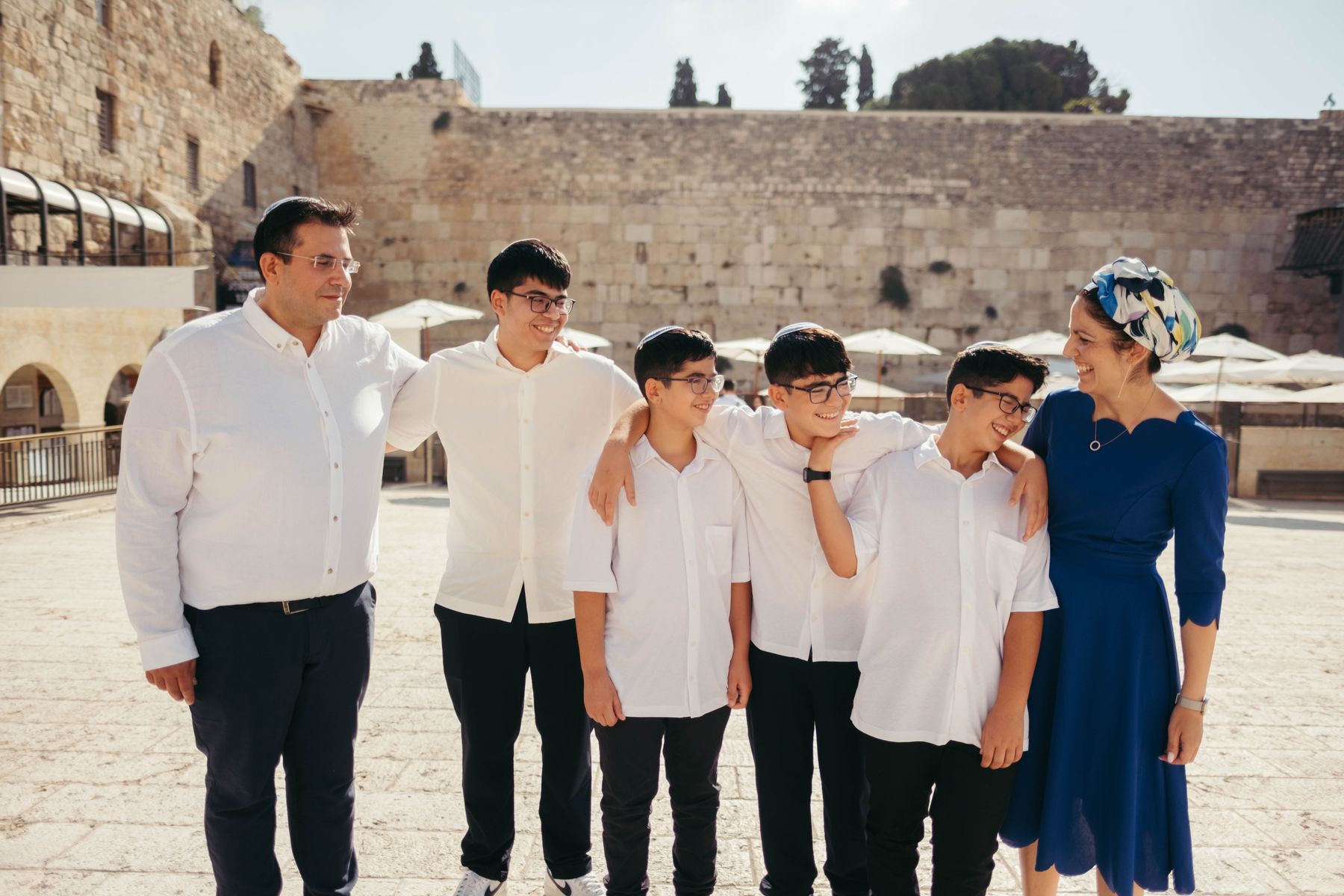 Family standing together in the Western Wall plaza