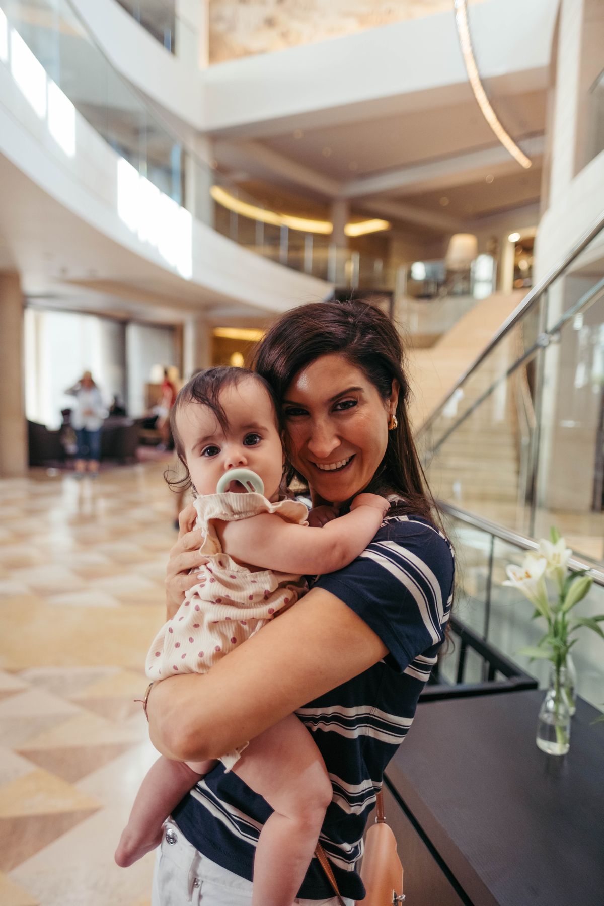 Mother holding her baby daughter